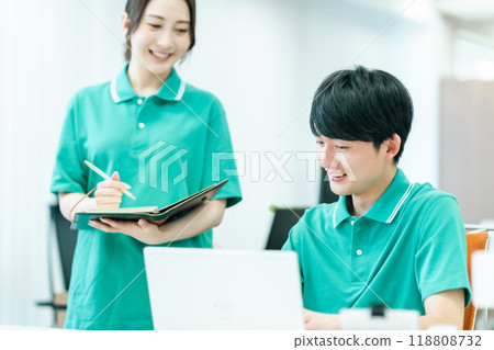A young care manager working in uniform A young care manager working in uniform 118808732