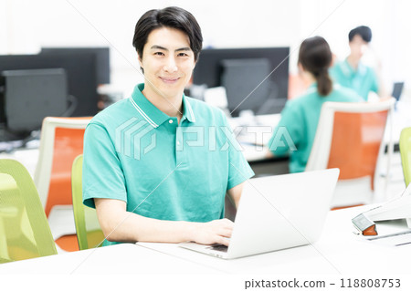 Male office staff working in uniform Male office staff working in uniform 118808753