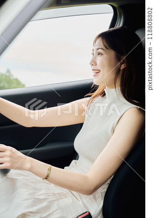 Woman driving in the wilderness 118808802