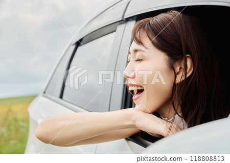 woman looking out of car window woman looking out of car window 118808813