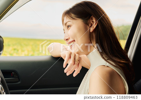 Woman driving in the wilderness 118809463
