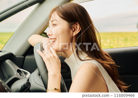 Woman driving in the wilderness 118809466