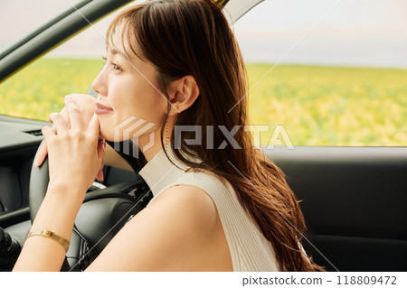 Woman driving in the wilderness 118809472