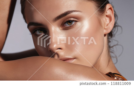 A close-up portrait of a woman with glowing skin, showcasing her natural beauty 118811009