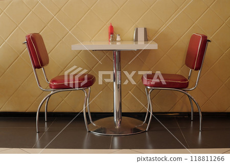 Empty Retro Diner Booth with Red Upholstered Chairs Empty Retro Diner Booth with Red Upholstered Chairs 118811266
