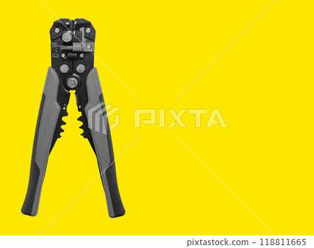 Electrician tool, wire stripper for cable stripping, network installing. Yellow background with copy Electrician tool, wire stripper for cable stripping, network installing. Yellow background with copy 118811665