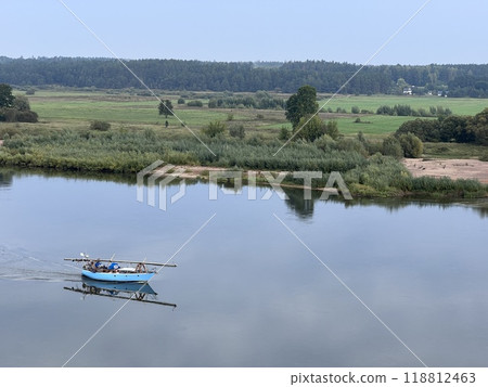 Lonely small boat in the river, shot in the air from hill in Lithuania, quit day, aerial 118812463