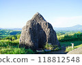 In front of the "Oshido Stone" at the summit of "Oshido Stone Hill" in Minamioguni, Aso 118812548
