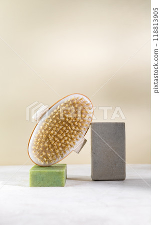 Minimalist still life with natural handmade soap and massage sponge 118813905