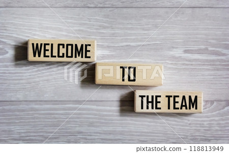 Conceptual words Welcome to the team on a wooden block. On a gray background. Business, motivation Conceptual words Welcome to the team on a wooden block. On a gray background. Business, motivation 118813949