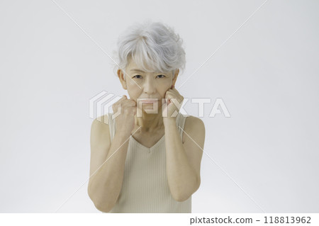 Angry gray-haired senior woman Angry gray-haired senior woman 118813962