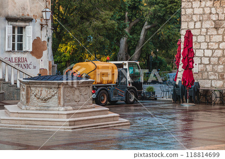Krk Croatia 28.06.24A car washes cobblestones in the city center in the morning Krk Croatia 28.06.24A car washes cobblestones in the city center in the morning 118814699