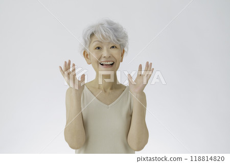 A senior woman with white hair and a surprised face A senior woman with white hair and a surprised face 118814820