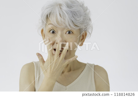 A senior woman with white hair and a surprised face A senior woman with white hair and a surprised face 118814826