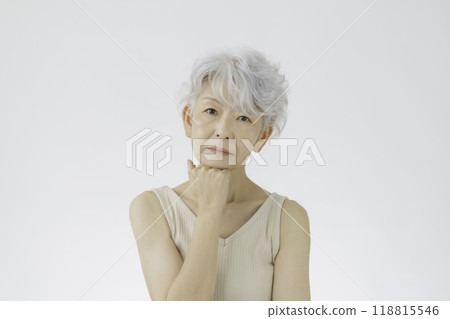 Thinking gray-haired senior woman Thinking gray-haired senior woman 118815546