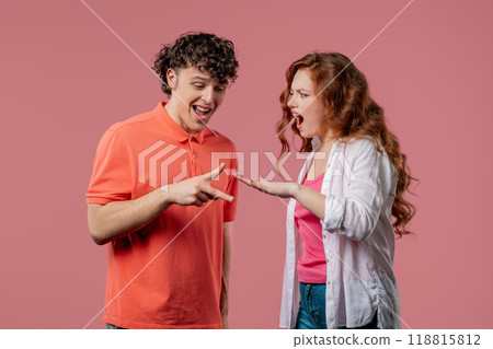 Positive funny couple playing rock paper scissors. Rochambeau team games. Settling dispute method, decision 118815812