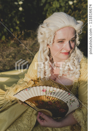 Portrait of blonde woman dressed in historical Baroque clothes with old fashion hairstyle 118816674