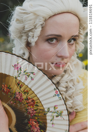 Portrait of blonde woman dressed in historical Baroque clothes with old fashion hairstyle Portrait of blonde woman dressed in historical Baroque clothes with old fashion hairstyle 118816691