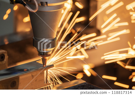 Close up scene the fiber laser cutting machine cut the square shape stainless steel tube with sparkling light. Close up scene the fiber laser cutting machine cut the square shape stainless steel tube with sparkling light. 118817314