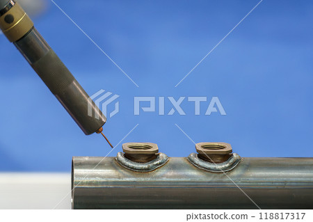 Close up scene of the robot welding machine operation with steel pipe. 118817317