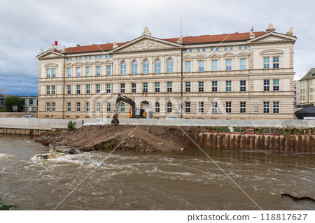 Yellow excavator on the bank of the river Svratka, Brno, Czech republic, floods after storm Boris, September 15, 2024. 118817627