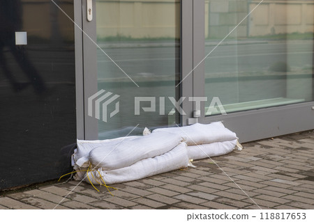 Sand bags in front of the door in the house on riverbank of Svratka, Brno, Czech republic, floods after storm Boris, September 15, 2024. Sand bags in front of the door in the house on riverbank of Svratka, Brno, Czech republic, floods after storm Boris, September 15, 2024. 118817653
