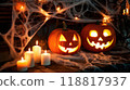 carved jack o lanterns with glowing faces. Spooky Halloween Pumpkins and Candles 118817937