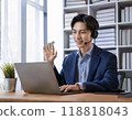 Businessmen having an online meeting 118818043