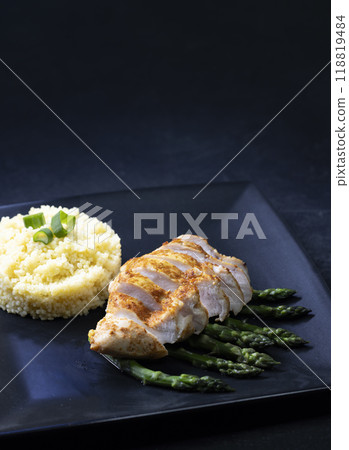 Green asparagus with grilled chicken fillet and couscous Green asparagus with grilled chicken fillet and couscous 118819484