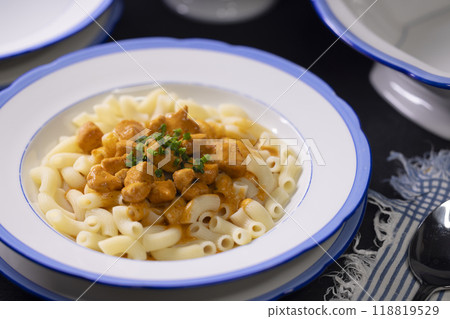 Traditional czech dish, chicken with paprika creamy sauce with pasta - typical for czech or middle europe. 118819529