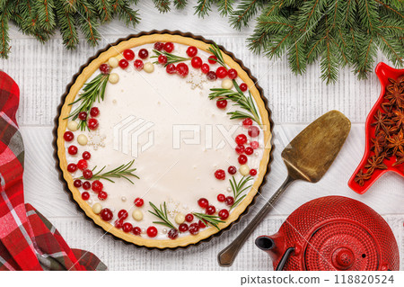 Christmas cake adorned with berries and rosemary 118820524