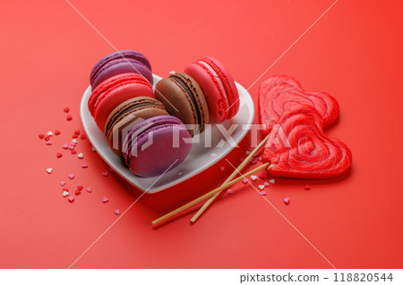 Various colorful macaroons in heart shaped bowl Various colorful macaroons in heart shaped bowl 118820544