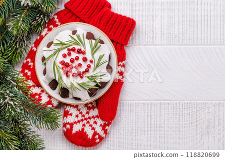 Festive Christmas cake decorated with seasonal designs 118820699