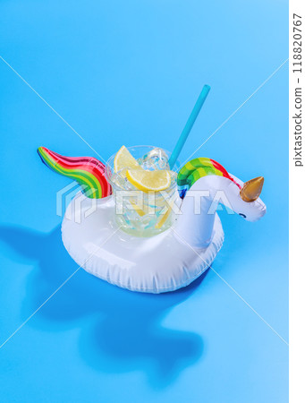 A vibrant summer vacation scene with floating flamingo and cocktail 118820767
