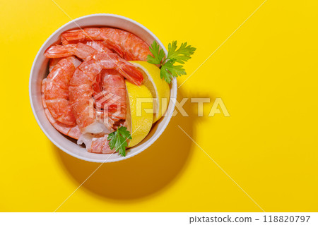 Fresh shrimps, accompanied by sprigs of fresh parsley and juicy lemon Fresh shrimps, accompanied by sprigs of fresh parsley and juicy lemon 118820797