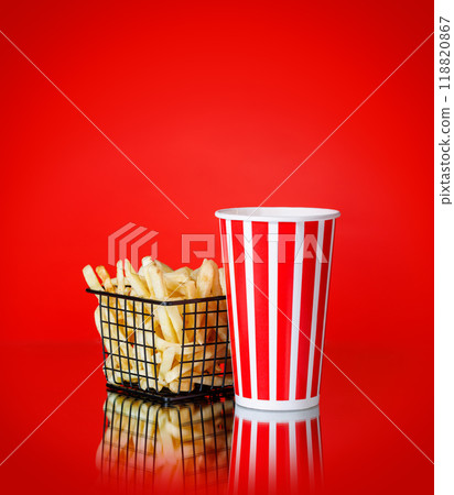 French fries and a cup of cola on a red background French fries and a cup of cola on a red background 118820867