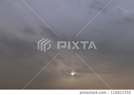 A sky, with diffused sun, clouds, colourful, 118821350