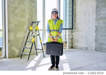 Portrait of female industrial worker builder engineer supervisor at construction 118821818
