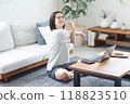 Woman stretching in the living room at home 118823510