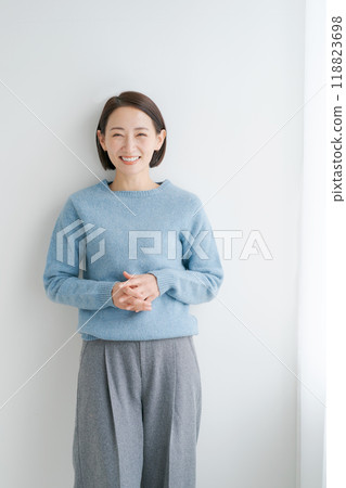 Woman wearing blue knitwear 118823698