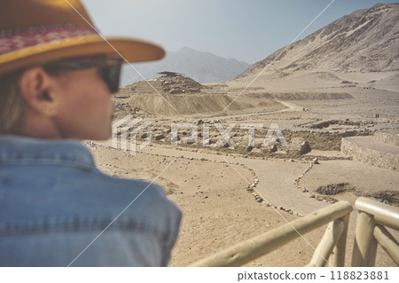 Young Latin woman in archaeological site of the Sacred City of Caral, Peru. Caral is a UNESCO world heritage site and considered to be the oldest city in the Americas. Young Latin woman in archaeological site of the Sacred City of Caral, Peru. Caral is a UNESCO world heritage site and considered to be the oldest city in the Americas. 118823881
