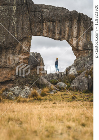 Woman in rock megalithic, Huayllay Stone Forest, Peru. 118823920