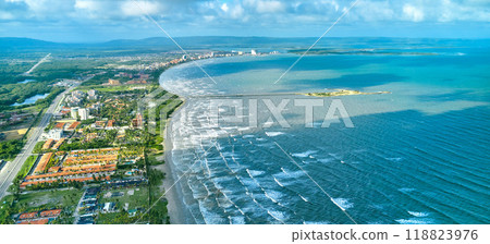 Beautiful Caribbean road with palm trees along the coast of Venezuela, Tucacas hotel zone, aerial view. Beautiful Caribbean road with palm trees along the coast of Venezuela, Tucacas hotel zone, aerial view. 118823976
