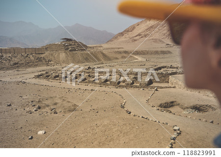 Young Latin woman in archaeological site of the Sacred City of Caral, Peru. Young Latin woman in archaeological site of the Sacred City of Caral, Peru. 118823991