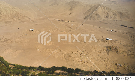 top view the ancient archaeological site of Caral, near Supe, Barranca Province, Peru. Caral is a UNESCO world heritage site and considered to be the oldest city in the Americas. 118824024