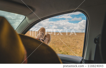 A person is laying down in the back of a car. Huayllay Stone Forest, Peru. 118824043