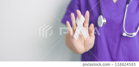 Stop Violence Against Women and November Lung Cancer Awareness month. Doctor with White ribbon in hospital. Healthcare and World Cancer day concept 118824583