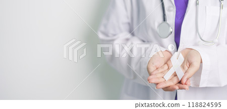Stop Violence Against Women and November Lung Cancer Awareness month. Doctor with White ribbon in hospital. Healthcare and World Cancer day concept 118824595