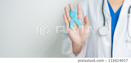 Blue November Prostate Cancer Awareness month, Doctor with Blue Ribbon in hospital for support people life and illness. Healthcare, International men, Father, Diabetes and World cancer day Blue November Prostate Cancer Awareness month, Doctor with Blue Ribbon in hospital for support people life and illness. Healthcare, International men, Father, Diabetes and World cancer day 118824657