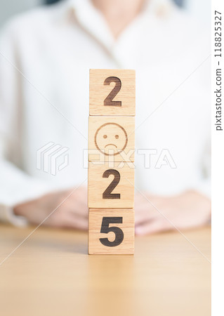 Happy New Year 2025 with Sad face block. Satisfaction, feedback, Review, mental health, eco sustainable and bad year concept Happy New Year 2025 with Sad face block. Satisfaction, feedback, Review, mental health, eco sustainable and bad year concept 118825327